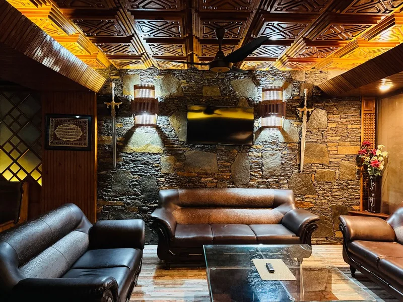 Guest lounge seating area at Pameer Hotel Mingora